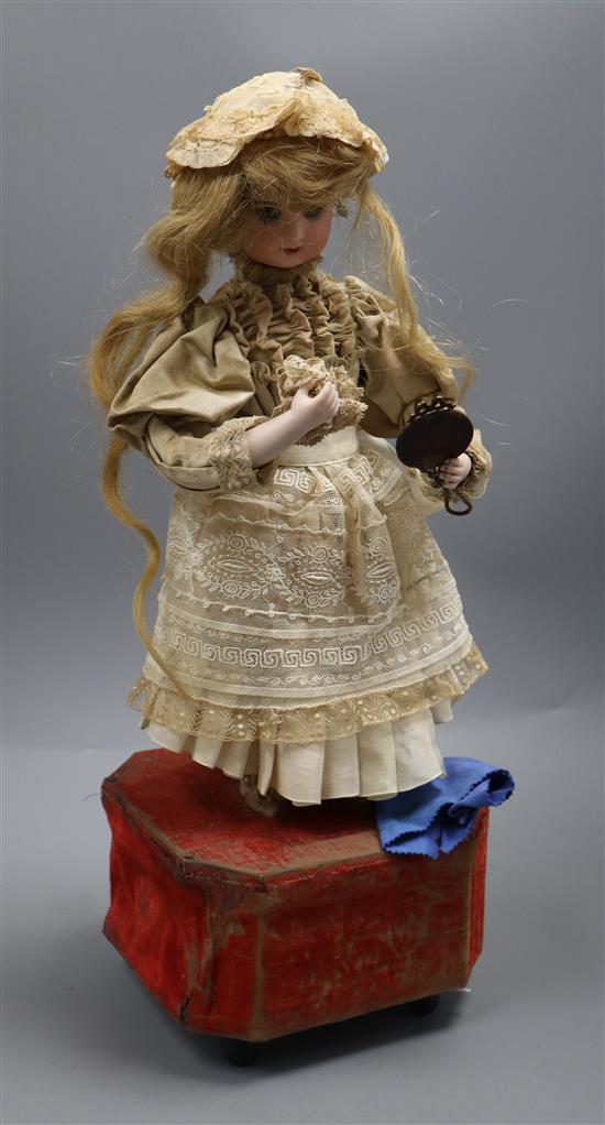 A Roullet et Decamps lady with powder puff and mirror automaton with a closed mouth Jumeau head, H.45cm, some wear to fabrics